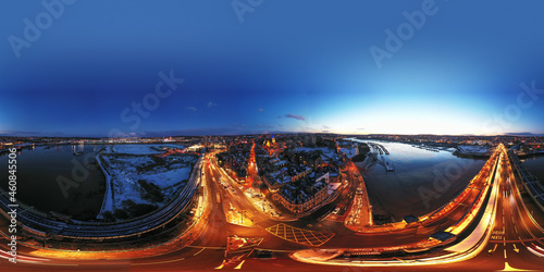 Aerial 360 degrees equirectangular photosphere of snow covered historical Rochester at winter night. photo