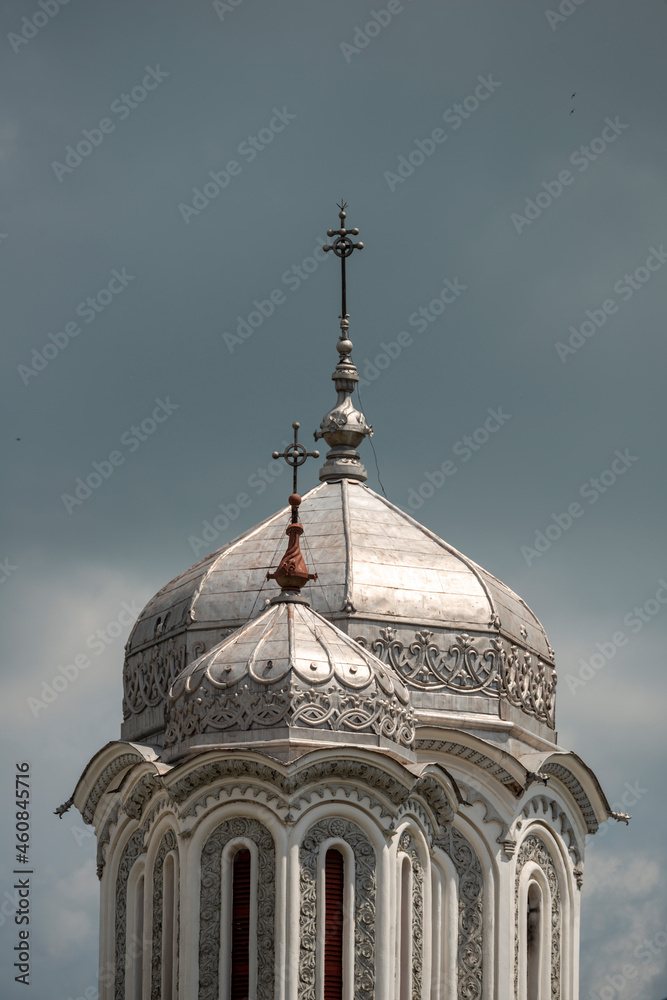 Silver colored metal orthodox church domes reflecting sunlight