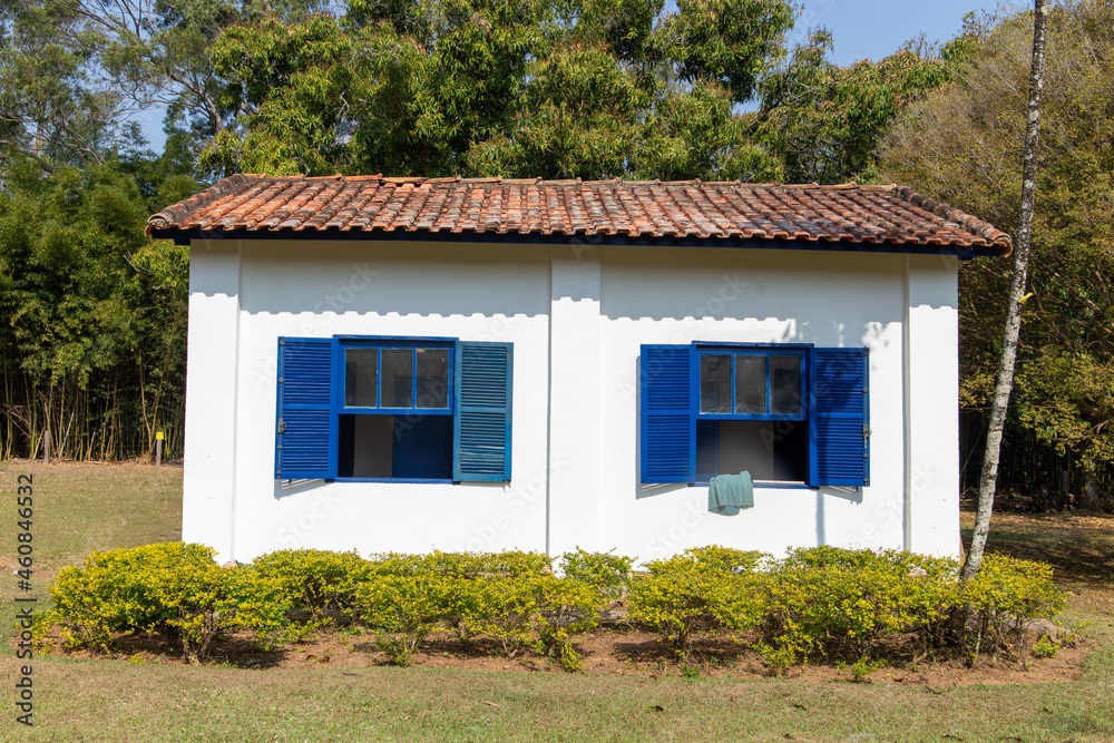 old colonial house on a historic farm in São Paulo, Brazil. Blue wooden windows.