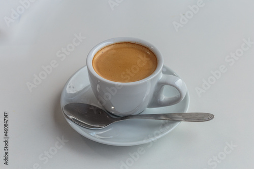 A cup of coffee for a business lunch. Nobody, isolated.