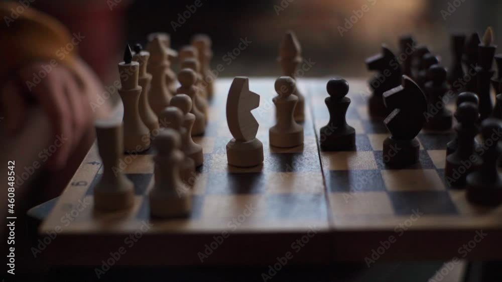 Close-up tracking shot of confident businesswoman playing chess game to development analysis strategy plan, leader and teamwork. Closeup of chess board with female hand moving the white horse figure. Close-up tracking shot of confident businesswoman playing chess game to development analysis strategy plan, leader and teamwork. Closeup of chess board with female hand moving the white horse figure.
