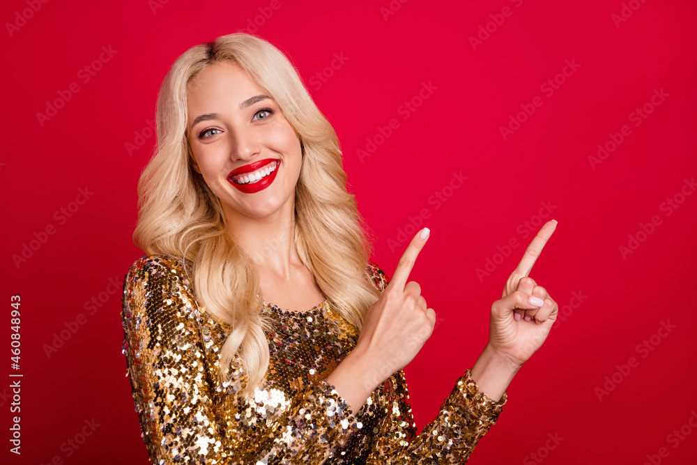 Obraz premium Photo of adviser lady indicate forefingers empty space novelty sale wear golden dress isolated red color background