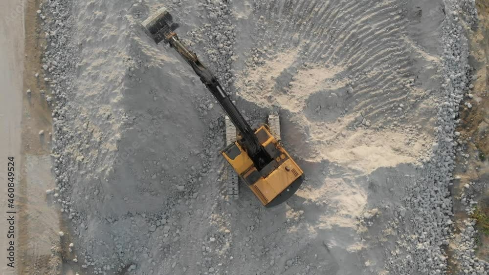 Aerial view from drone to excavator during work Aerial view from drone to excavator during work