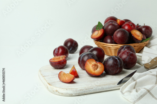 Concept of fruit with plums on white background