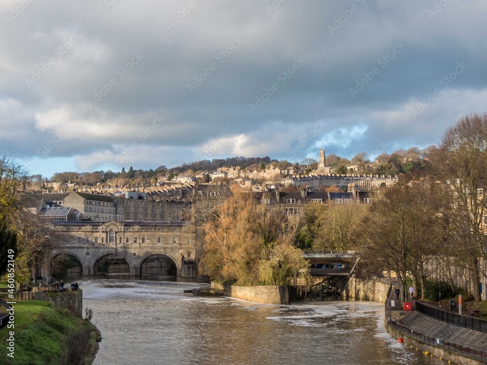 the picturesque horseshoe weir at Pulteney Bridge built in the 1600s to prevent flooding in Bath Somerset England