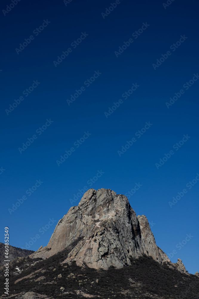 Peña de Bernal México mountain landscape with blue sky and clouds