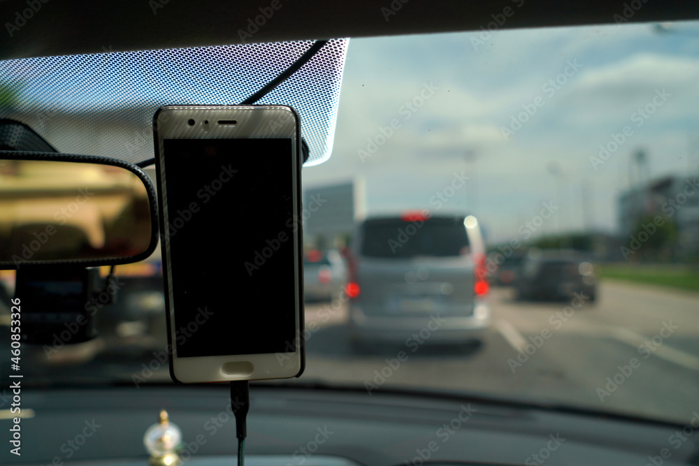 Smartphone in a car use for Maps and Navigators, Safety concept and technology.