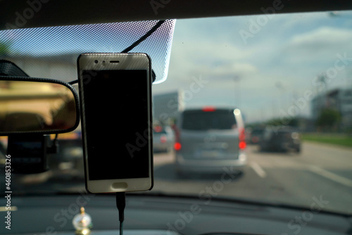 Smartphone in a car use for Maps and Navigators, Safety concept and technology.
