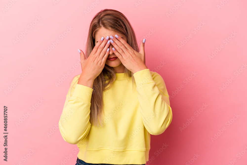 Young russian woman isolated on pink background afraid covering eyes with hands. Young russian woman isolated on pink background afraid covering eyes with hands.