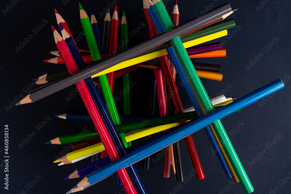 Fototapeta premium colored pencils on a black background