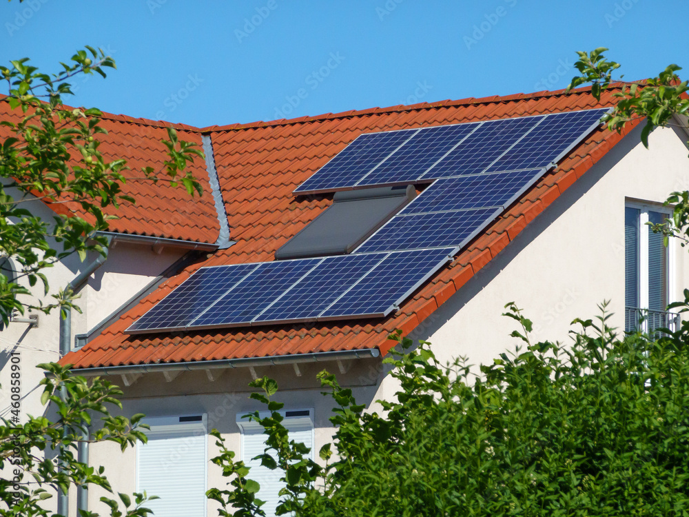 solar panels on a roof in the suburbs solar panels on a roof in the suburbs