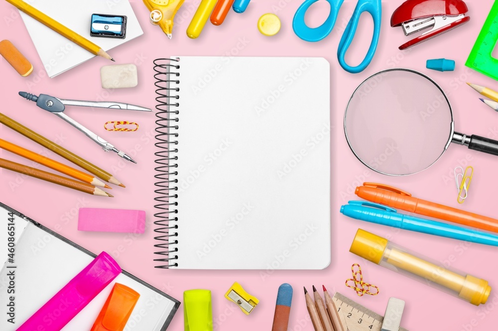 School supplies on a colored background. Creative layout with school stationery. School supplies on a colored background. Creative layout with school stationery.