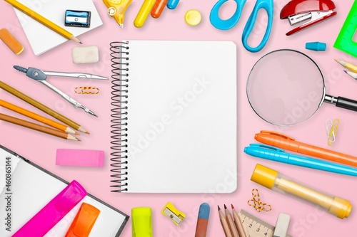 School supplies on a colored background. Creative layout with school stationery.