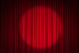 Red stage curtain with spotlight