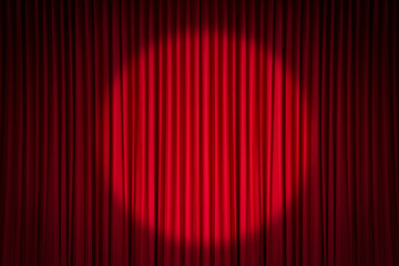 Red stage curtain with spotlight