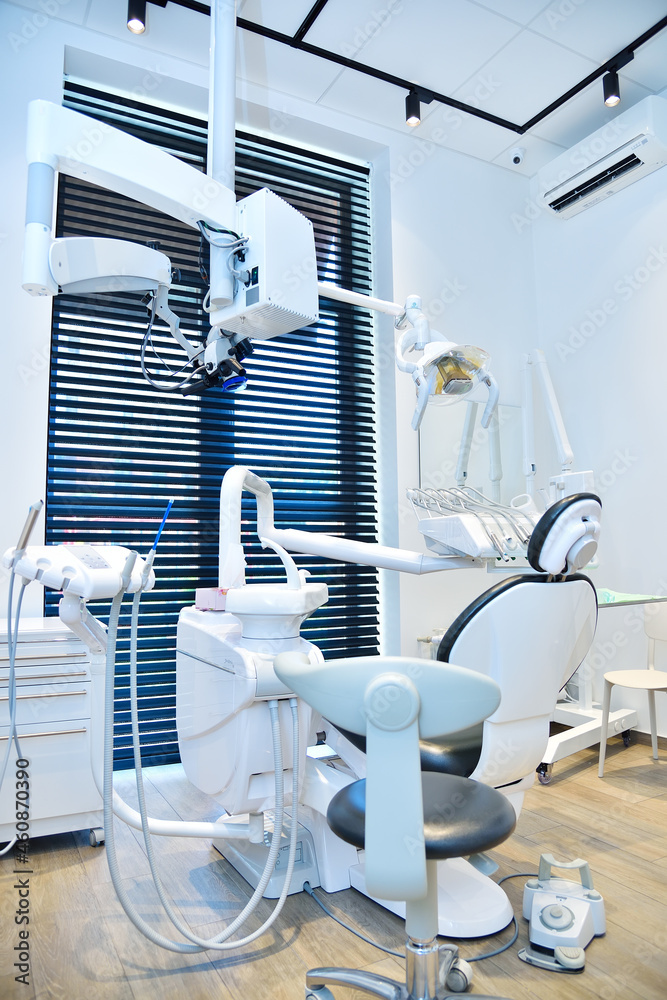 Stomatological office with dental chair and equipment.