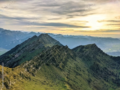 View from the Speer mountain peak in the toggenburch towards Federispitz and the Glarus Alps. Sunset in Switzerland. photo