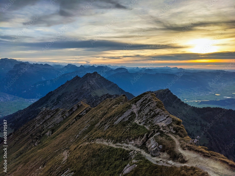 View from the Speer mountain peak in the toggenburch towards Federispitz and the Glarus Alps. Sunset in Switzerland.