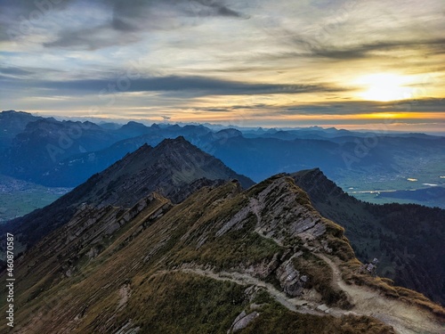 View from the Speer mountain peak in the toggenburch towards Federispitz and the Glarus Alps. Sunset in Switzerland.