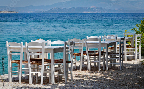 Tables by the sea in Greece