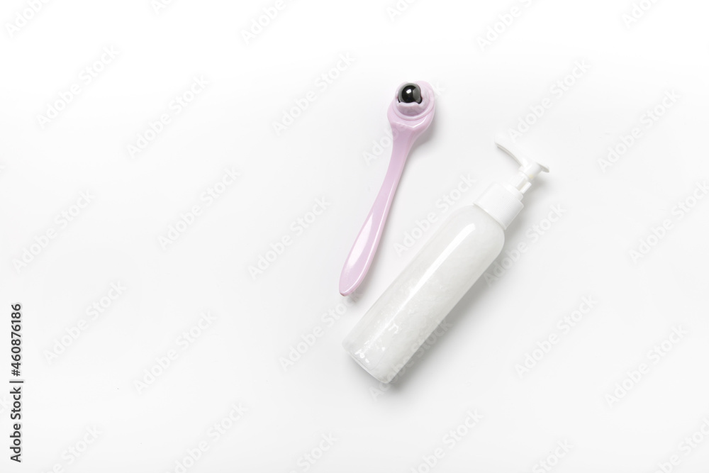 white cosmetic bottle with a jar of cream on a light background white cosmetic bottle with a jar of cream on a light background