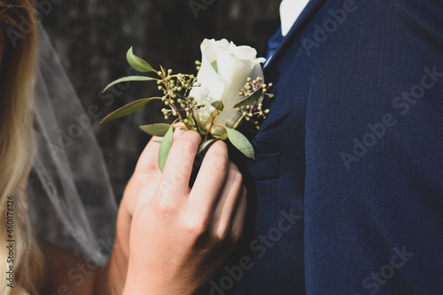 Wedding Boutineer Pinning on Suit Photography  photo
