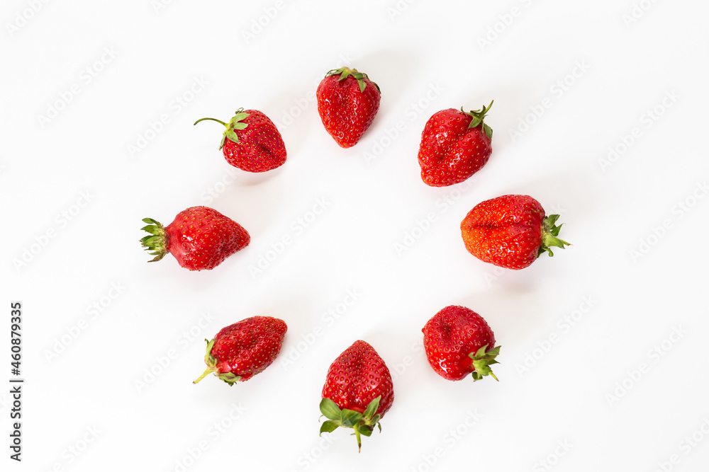 Red strawberries, arranged on a white background. Red strawberries, arranged on a white background.