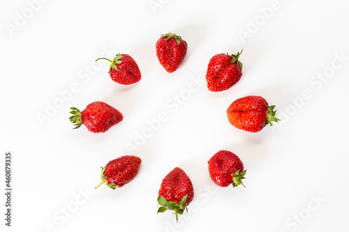 Red strawberries, arranged on a white background.