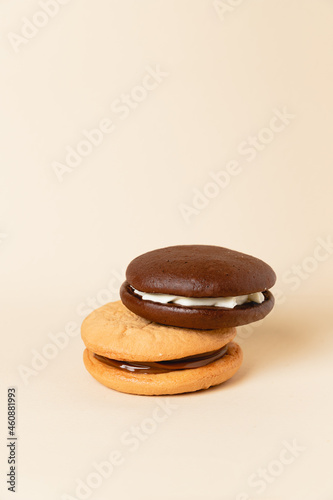 Close up Traditional chocolate and Pumpkin Whoopie pies. Background for bakeries, cafes, restaurants, copy space photo
