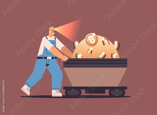 man miner pushing bitcoins in mine cave mining crypto coins digital cryptocurrency blockchain concept