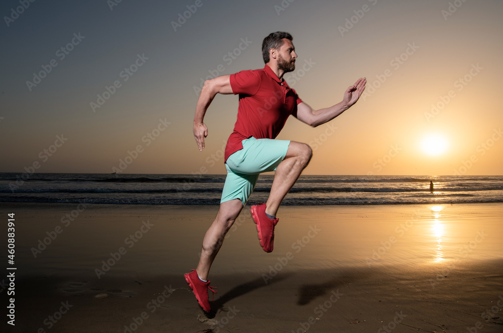 athletic man runner running on sunset summer beach, athlete athletic man runner running on sunset summer beach, athlete