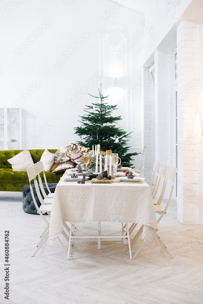 Cozy classic table for celebrating Christmas or New Year in a Scandinavian style.