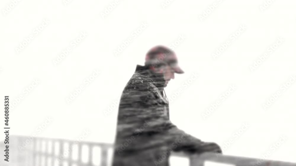 A man in his 40s feeling sad during a midwest winter storm. A man in his 40s feeling sad during a midwest winter storm.
