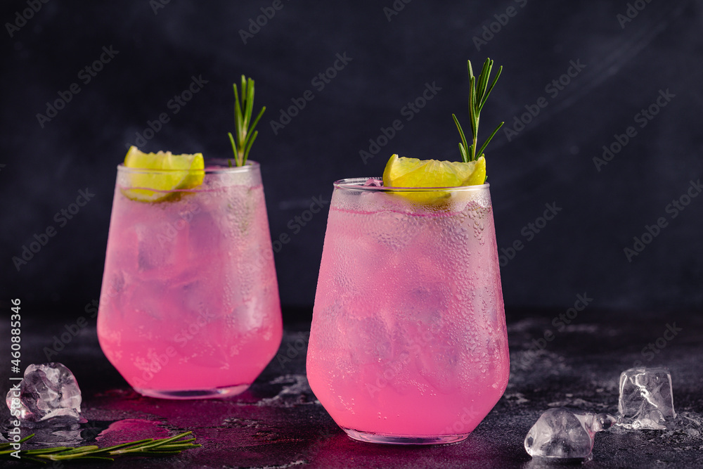Refreshing pink drink or cocktail with ice - obrazy, fototapety, plakaty 