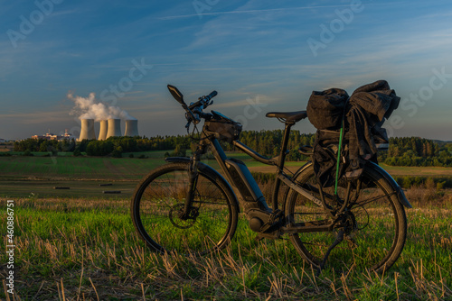 Black electric bicycle near nuclear power plant near Temelin village