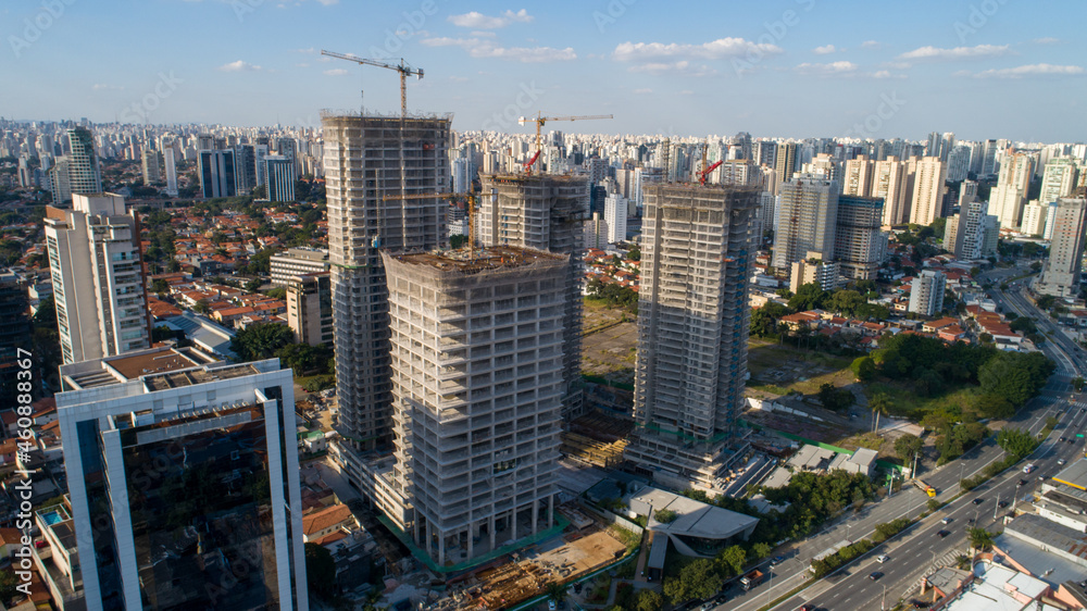 Aerial drone view of the Brooklin neighborhood in São Paulo, Brazil. Four tall buildings under construction