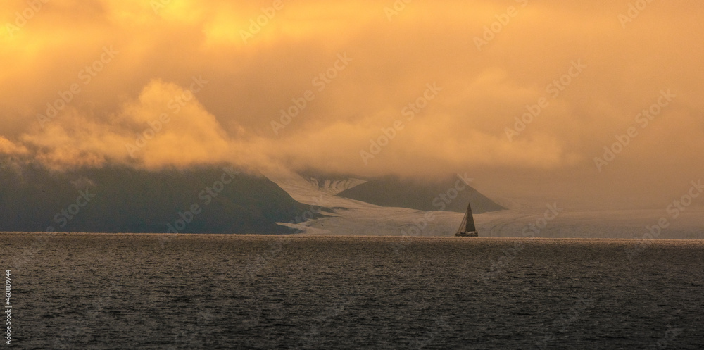 Sailboat in front of glacier in Svalbard