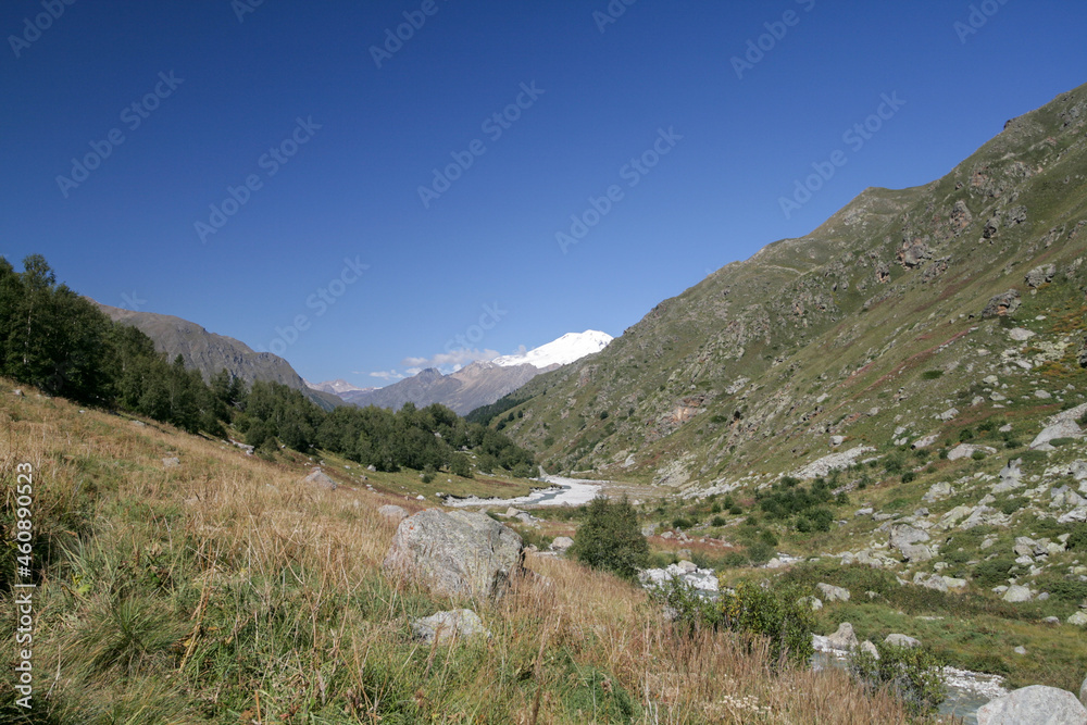 View of the mountain valley of Adyl-Su, Elbrus region, Russia. View of the mountain valley of Adyl-Su, Elbrus region, Russia.