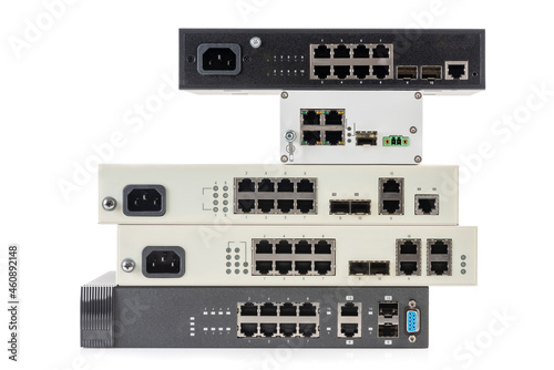 Pile of network ethernet gigabit switches isolated on white background photo