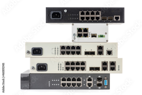 Photos Pile of network ethernet gigabit switches isolated on white background