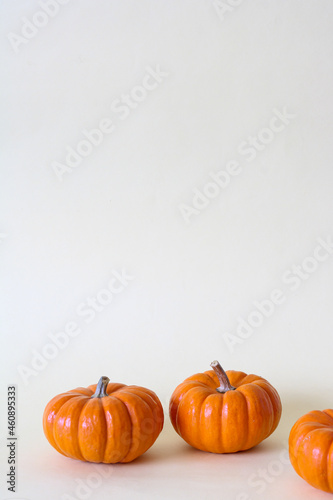 mini pumpkins, orange color, natural, halloween, white background or solid color, minimalist style