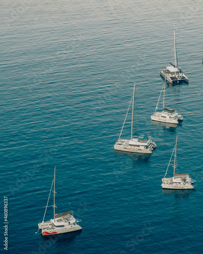 Yachts on blue sea in Santorini, Greece