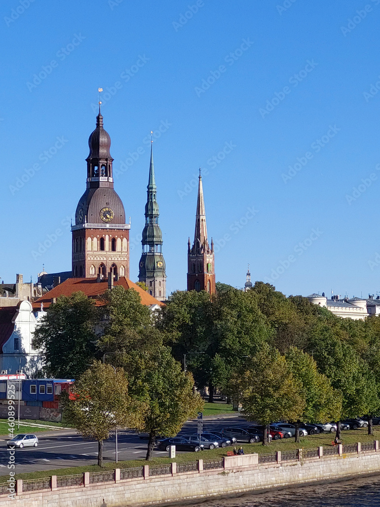 View from the cable-stayed bridge to the towers of the Old Town of Riga (Latvia, Europe) on a sunny autumn day