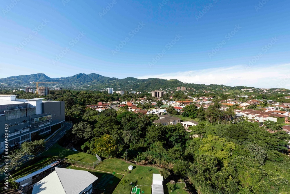 Panoramic city landscape with blue sky. Escazu, San Jose, Costa Rica. 