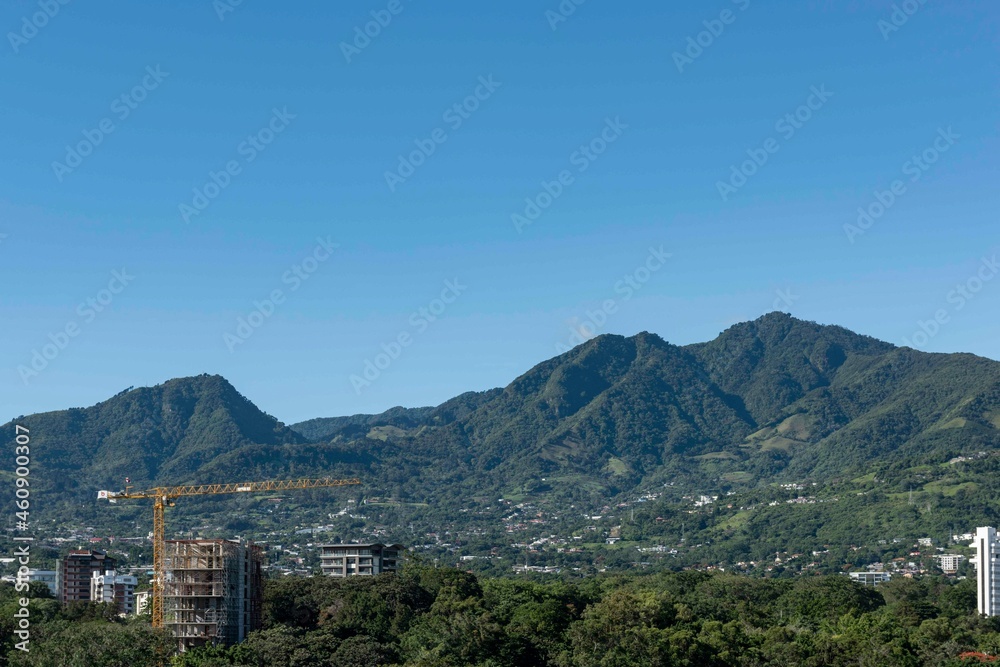 Panoramic city landscape with blue sky. Escazu, San Jose, Costa Rica. Panoramic city landscape with blue sky. Escazu, San Jose, Costa Rica.