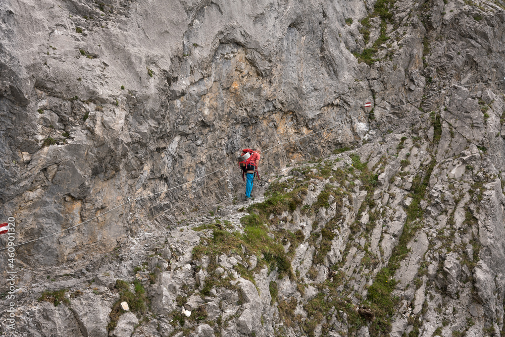 Mountaineer man climbs on top mountains