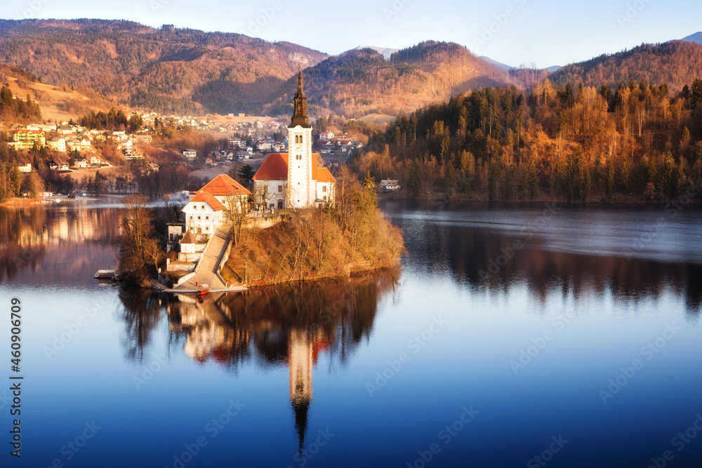 Lake Bled, Julian Alps, Slovenia. Aerial view of the church located on the island. Colorful autumn landscape with the lake on a clear sunny day.