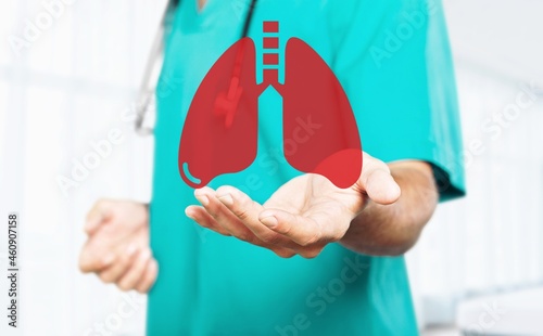 Human hands holding lung organ symbol. Awareness of cancer, pneumonia, asthma,