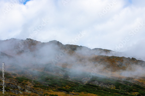 landscape with the ridges of the Fagaras mountains among the clouds