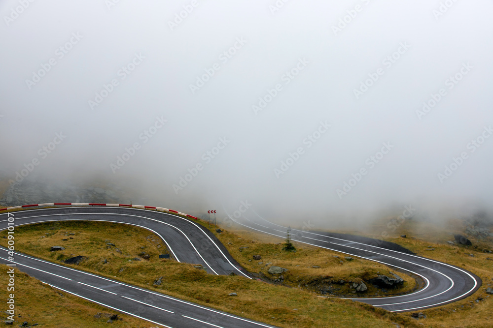 A mountain road through the fog